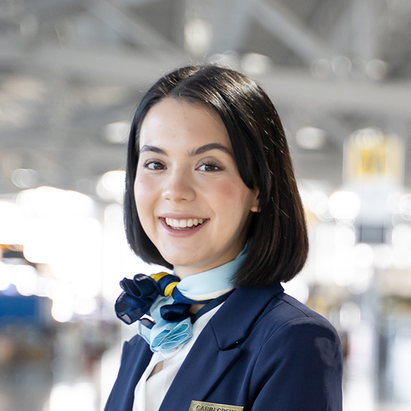 portrait of caucasian flight attendant standing in DTYQZ37.jpg